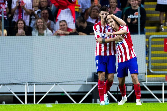 10 August 2019, Sweden, Stockholm: Atletico Madrid's Joao Felix (R) celebrates scoring his side's second goal with teammate Alvaro Morata during the International Champions Cup soccer match between Atletico Madrid and Juventus at Friends Arena. Photo: Ken
