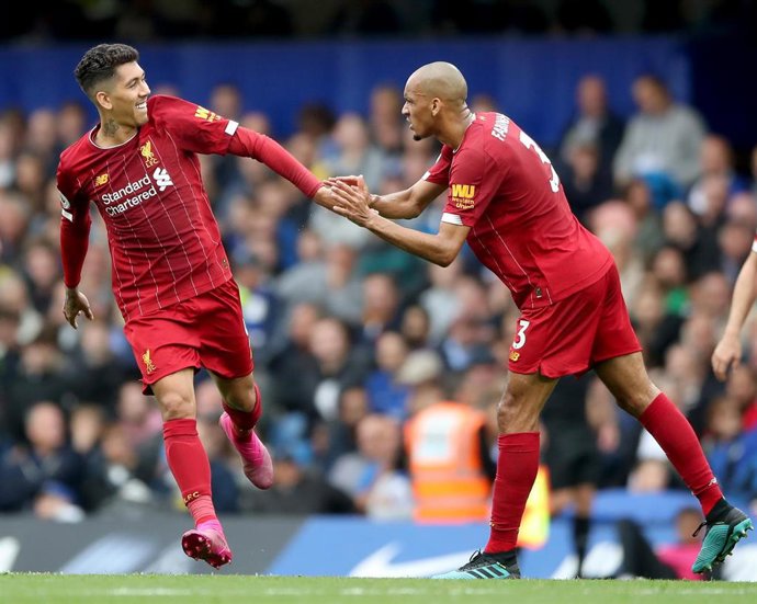 22 September 2019, England, London: Liverpool's Roberto Firmino (L) celebrates scoring his side's second goal with teammate Fabinho during the English Premier League soccer match between Chelsea and Liverpool at Stamford Bridge. Photo: Nick Potts/PA Wir