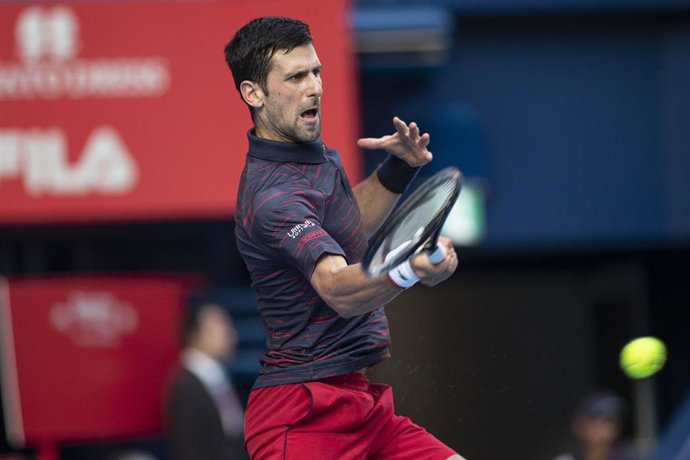 01 October 2019, Japan, Tokyo: Serbian tennis player Novak Djokovic returns to Australian Alexei Popyrin during their men's singles round of 32 tennis match at the Rakuten Japan Open Tennis Championships 2019 at Ariake Colosseum. Photo: Rodrigo Reyes Ma