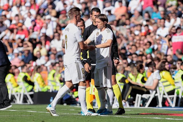 Toni Kroos (L) and Luka Modric (R) of Real Madrid during La Liga match between Real Madrid and Granada CF at Santiago Bernabeu Stadium in Madrid, Spain.