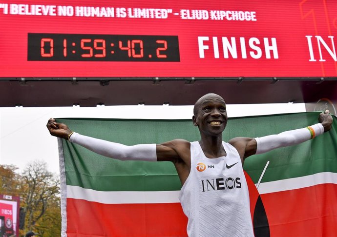12 October 2019, Austria, Vienna: Kenyan long-distance runner Eliud Kipchoge celebrates after crossing the finish line of the "Ineos 1:59 Challenge", to become the first athlete to run a marathon in under two hours, posting 1 hour 59 minutes and 40 seco