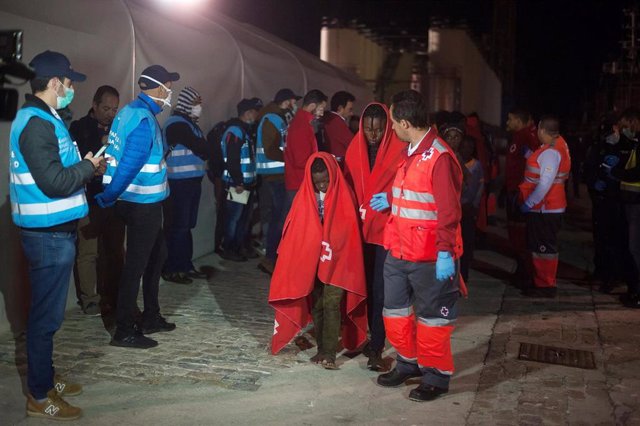 26 October 2019, Spain, Malaga: Migrants disembark a rescue boat at the port of Malaga, where the Spanish Red Cross will examine them. A French patrol ship from Frontex rescued 63 migrants and handed them over to a Spanish rescue ship. Photo: Jesus Merida