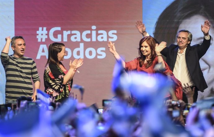 27 October 2019, Argentina, Buenos Aires: Argentinian Presidential candidate Alberto Fernandez (R) and his running mate, former President Cristina Fernandez de Kirchner (2nd R), wave at supporters during a ceremony at the Peronist Justicialist party hea