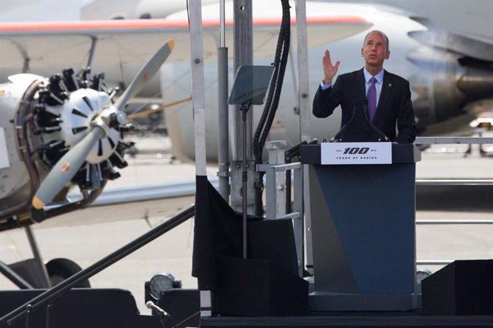July 15, 2016 - Seattle, Washington, United States: Boeing CEO Dennis Muilenburg stands at the podium backed by a passenger airplane and a Model 40 during a ceremony marking the company's 100th anniversary, at Boeing Field. (Grant Hindsley/Seattle PI/Co