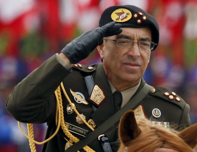 Former Peru Army Chief Edwin Donayre rides a horse as he greets troops during a ceremony at the general army headquarters in Lima December 5, 2008 - REUTERS/Pilar Olivares
