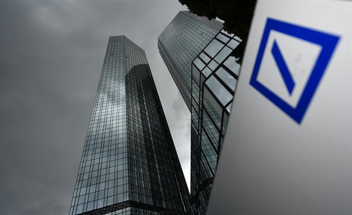 FILED - 20 May 2015, Hessen, Frankfurt/Main: Dark clouds raise above the headquarters of Deutsche Bank. Photo: Arne Dedert/dpa