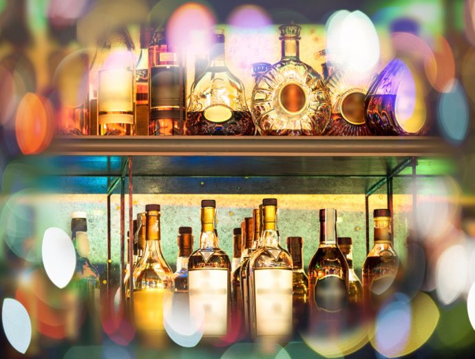 Set of Alcohol bottles on the wall with Bokeh