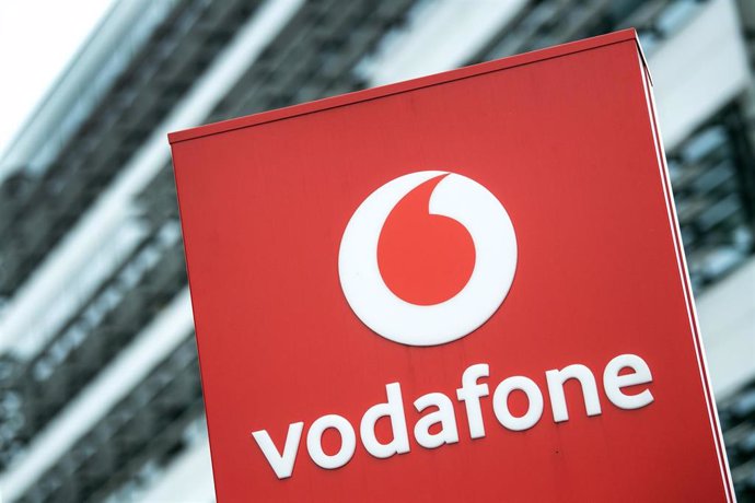 FILED - 16 July 2019, North Rhine-Westphalia, Duesseldorf: The Vodafone logo can be seen in front of the company building in Duesseldorf. Vodafone Idea to increase mobile service rates. Photo: Federico Gambarini/dpa