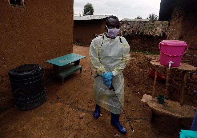 Kavota Mugisha Robert, a healthcare worker who volunteered in the Ebola response, prepares to decontaminate the house where a woman, 85, is suspected of dying of Ebola in the Eastern Congolese town of Beni