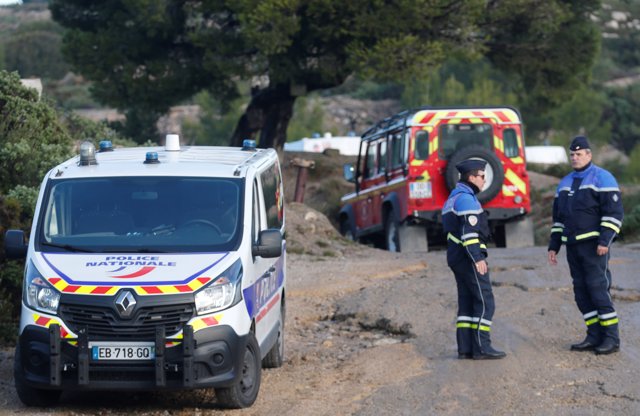 French police secure the area around the site where a helicopter from the civil security services crashed 