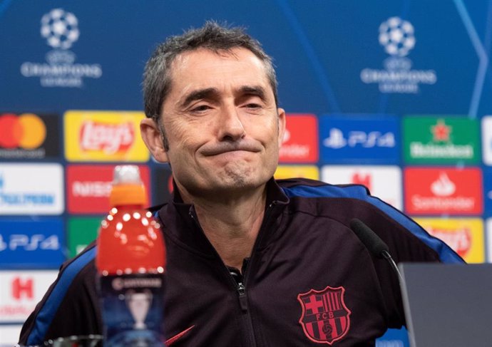 Barcelona coach Ernesto Valverde sits on the podium at a press conference ahead of the UEFA Champions League soccer match