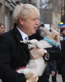 12 December 2019, England, London: UK Prime Minister Boris Johnson leaves with his dog Dylan after casting his vote in the UK General Election at Methodist Central Hall. Photo: Rick Findler/PA Wire/dpa