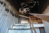 Dos fallecidos y un bebé en la UCI en Huelva por el incendio de un piso en la barriada de La Hispanidad