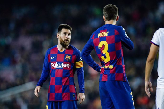 Messi y Piqué en un partido con el Bara