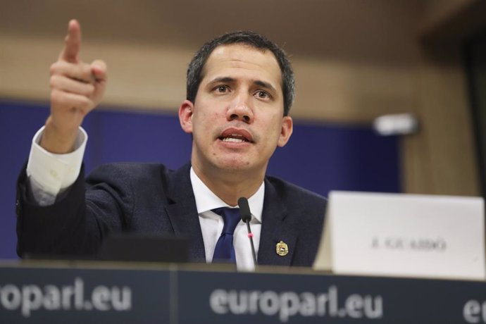 HANDOUT - 22 January 2020, Belgium, Brussels: Venezuelan opposition leader and self-appointed interim president Juan Guaido speaks at a press conference on the situation in Venezuela during his visit to the European Parliament. Photo: Didier Bauweraerts