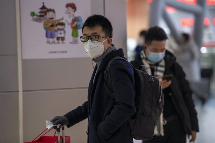 January 24, 2020 - Shanghai, China: Commuters at the long distance bus terminal at South Shanghai Railway Station wear protective face masks in wake of the coronavirus outbreak.