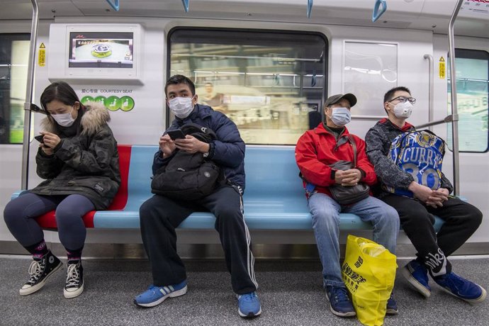 January 24, 2020 - Shanghai, China: Commuters ride the subway wearing protective face masks. There has been a marked increase in the use of such face masks in China in wake of the coronavirus outbreak. Yesterday the Chinese government took the unprecede