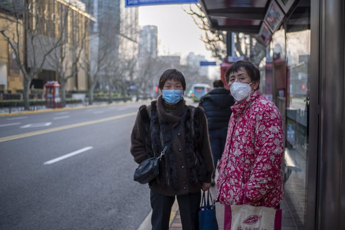February 3, 2020 - Shanghai, China: An elderly stand at a bus top on Middle Huaihai Road in the former French Concession. So far 361 people have died in China as a result of coronavirus infection, many of them elderly. (Dave Tacon/Contacto)