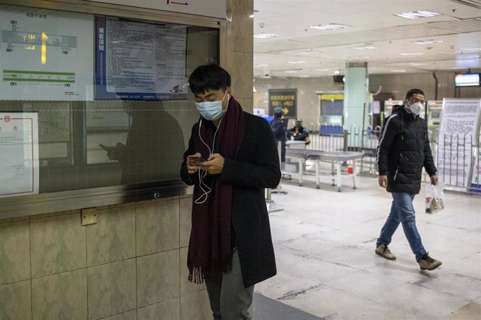 February 3, 2020 - Shanghai, China: Commuters wear protective masks inside East Nanjing Road metro station in Huangpu District, an area usually popular with tourists. The streets of Shanghai have been unusually quiet as people stay in doors to avoide co