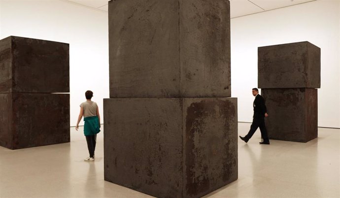 October 21, 2019 - New York, NY USA:  Visitors tour Richard Serra "Equal" which consists of eight forged steel boxes stacked in pairs