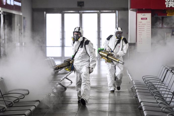 04 February 2020, China, Changsha: Volunteers from Blue Sky Rescue disinfect the Changsha railway station amid the outbreak of the coronavirus. Photo: -/TPG via ZUMA Press/dpa