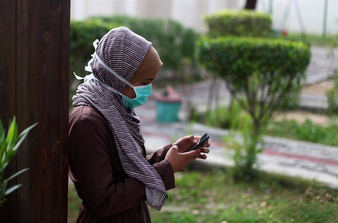 February 2020 - Gaza Strip, Palestinian Territories: Palestinian childern take part in a rally to support with people in China suffering from the Corona virus, in Gaza city, on February 16, 2020. China has more than 80 running or pending clinical trials
