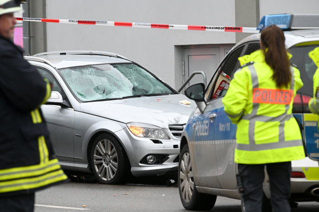 24 February 2020, Hessen, Volkmarsen: Policemen cordon off the scene where a car hurtled into a carnival parade. Multiple people have been reported injured while the driver of the vehicle was arrested. Photo: Uwe Zucchi/dpa