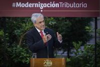 Piñera promulga la ley de modernización tributaria para mejorar "la calidad de vida de los chilenos"