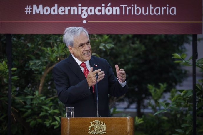 Chile.- Piñera promulga la ley de modernización tributaria para mejorar "la cali