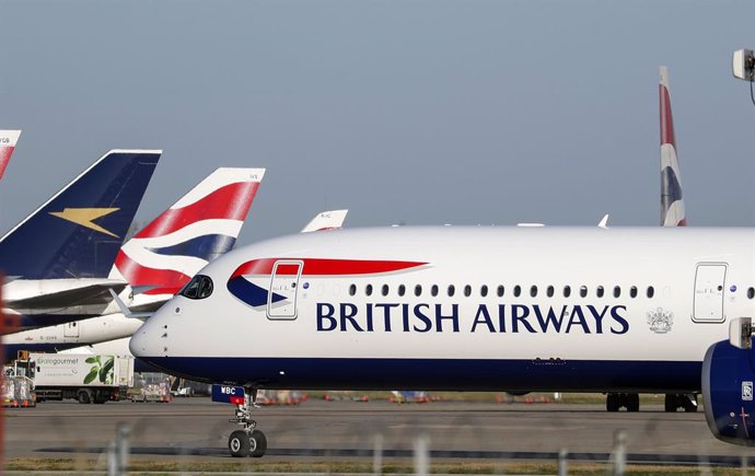 29 January 2020, England, London: British Airways planes are seen at Heathrow Airport. The airline has said that it has suspended all flights to and from mainland China with immediate effect after the Foreign Office warned against "all but essential tra