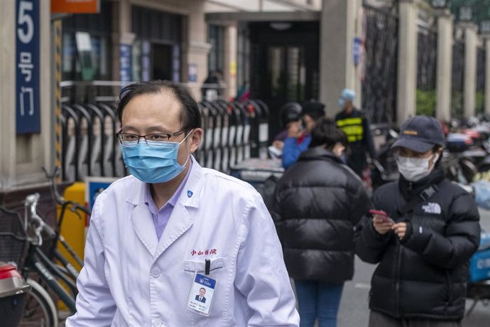 March 3, 2020, Shanghai China - A doctor wears a surgical mask as protection against the coronavirus outsiode Zhongshan Hospital in Xuhui Disrtrict. According to official figures more than 93,000 people have been infected with the virus and at least 3,1