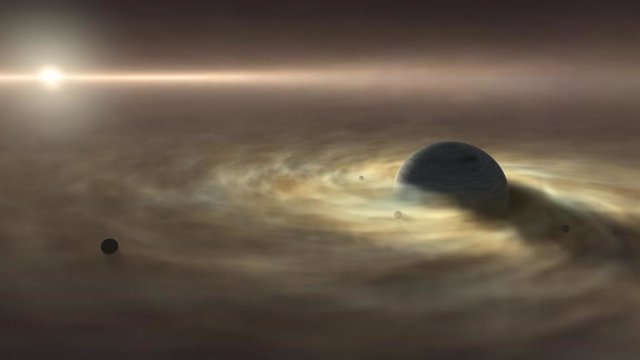 La impresión artística de un satélite que se forma alrededor de un planeta gigante de gas que todavía se está formando alrededor de una estrella.