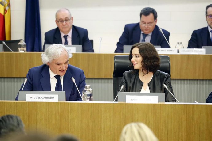 Imagen de la presidenta de la Comunidad de Madrid, Isabel Díaz Ayuso, y el presidente de CEIM, Miguel Garrido.
