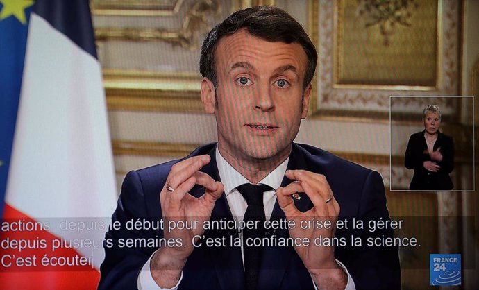 12 March 2020, France, Issy-les-Moulineaux: A picture taken from the transmission of a televised speech by French President Emmanuel Macron.