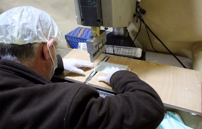 Coronavirus.- Presos belgas comienzan a fabricar mascarillas ante la falta de su