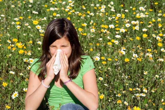 Hayfever or allergy, child blowing nose