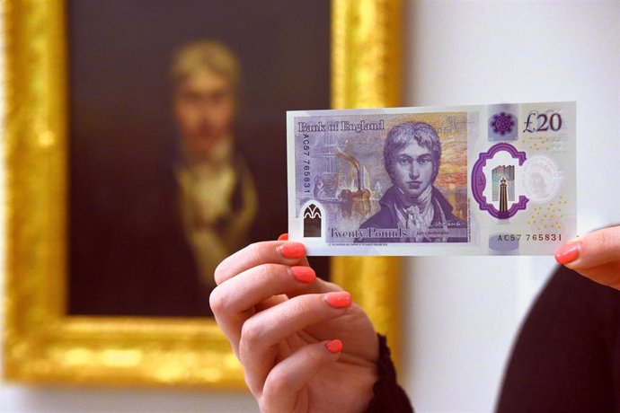 20 February 2020, England, London: A person holds the new 20 pound sterling note which features artist JMW Turner, at the Tate Britain. Photo: Kirsty O'connor/PA Wire/dpa