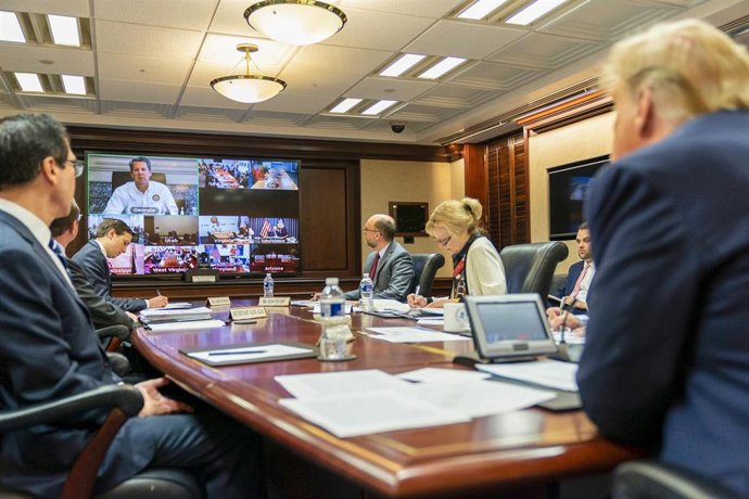 HANDOUT - 26 March 2020, US, Washington: US President Donald Trump holds a governors' video teleconference on partnership to prepare, mitigate and respond to coronavirus (COVID-19), in the White House Situation Room. (Official Photo by Shealah Craighead