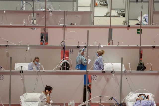Pacientes de coronavirus en las camas del Hospital temporal de la Comunidad de Madrid habilitado en IFEMA, en Madrid (España) a 31 de marzo de 2020.