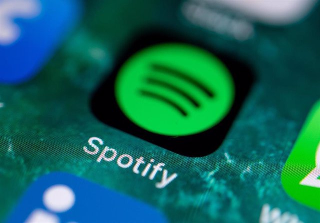 FILED - 21 June 2019, Stuttgart: The app icon of the music service Spotify can be seen on the display of an iPhone. Music streaming service Spotify Technology SA on Wednesday said it had 271 million users at the end of the 2019, an increase by almost a th