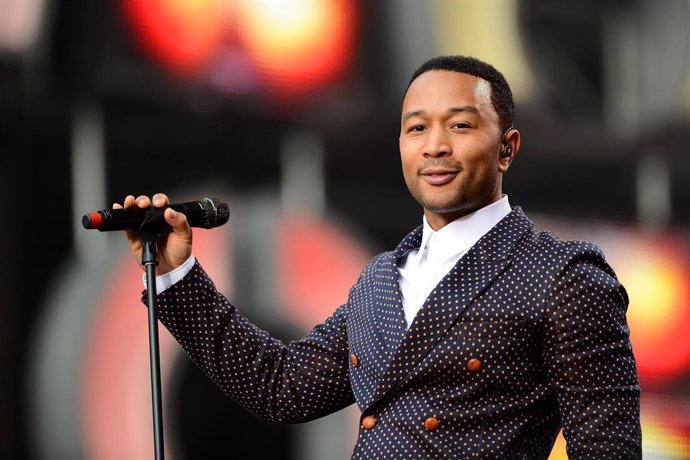 Singer John Legend performs on stage at the "Chime For Change: The Sound Of Change Live" Concert at Twickenham Stadium
