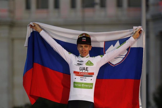15 September 2019, Spain, Madrid: Slovenian cyclist Tadej Pogacar of UAE Team Emirates celebrates on the podium in the white jersey for best young rider after the final stage of the 2019 edition of the "Vuelta a Espana"