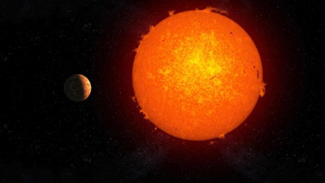 Representación artística del exoplaneta rocoso 'Próxima b' orbitando su estrella, 'Próxima Centauri'