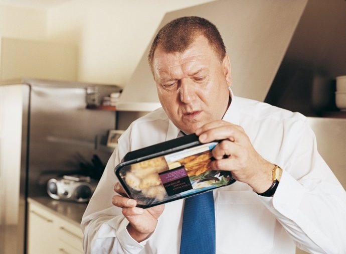 Man Holding Reading Label on Food