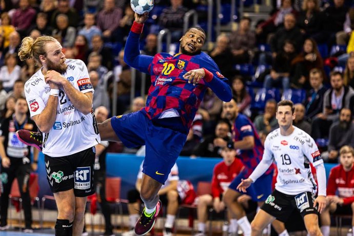Cedric Sorhaindo, #10 player of Fc Barcelona Handbol from France and Henrik Mollgaard, #21 player of Aalborg Handbold from Denmark, during the VELUX EHF Champions League match between  FC Barcelona  and Aalborg Handbold on November 2019 at Palau Blaugra