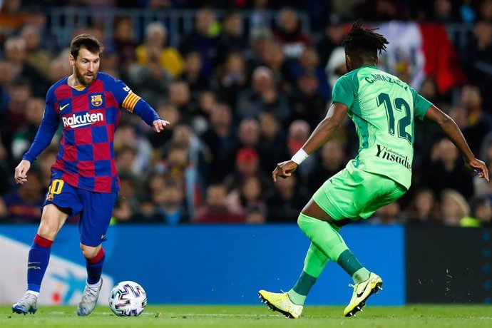 30 January 2020, Spain, Barcelona: Barcelona's Lionel Messi and Leganes' Chidozie Awaziem in action during the Spanish Copa del Rey soccer match between FC Barcelona and CD Leganes at the Camp Nou stadium. Photo: Eric Alonso/ZUMA Wire/dpa