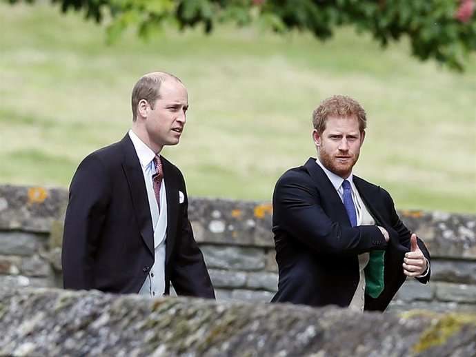Britain's Prince William, left, and his brother Prince Harry arrive for the wedding of Pippa Middleton and James Matthews at St Mark's Church on May 20, 2017 in Englefield.
