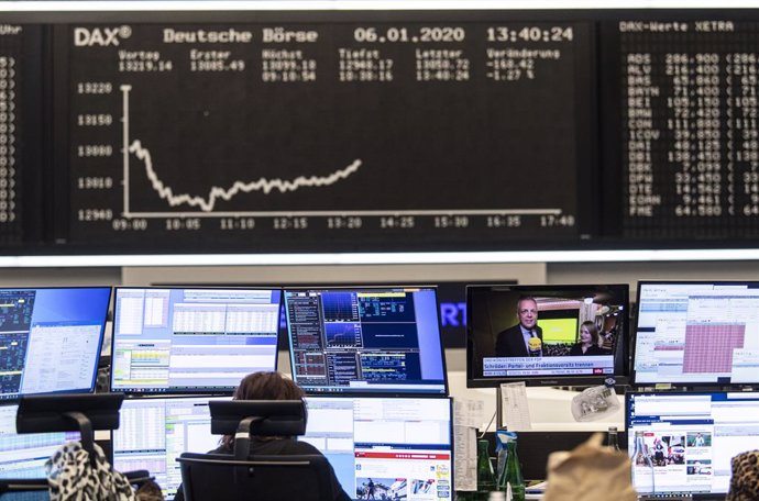 06 January 2020, Hessen, Frankfurt_Main: A estoc trader works on the Frankfurt Estoc Exchange, as the conflict between the USA and Iran has further unsettled investors in the German estoc market. The Dax temporarily slipped below the 13,000 mark, a low 