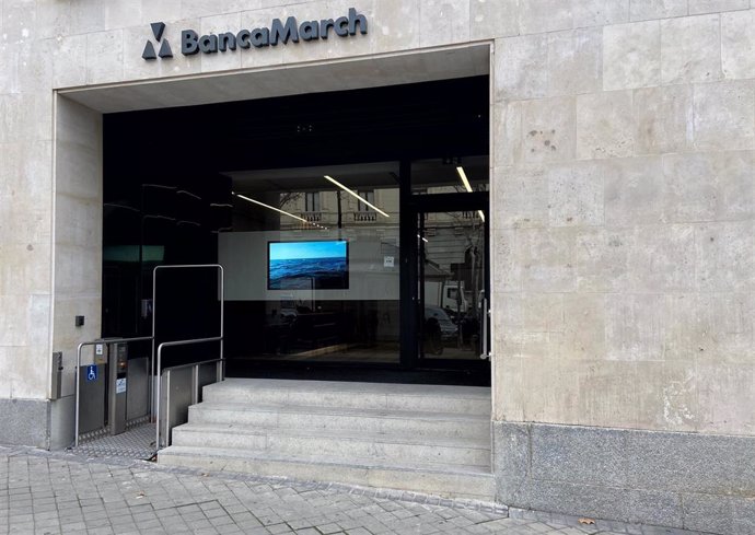 Puerta principal de un local de Banca March en Madrid (España), a 13 de febrero de 2020.