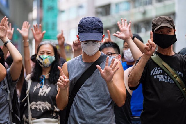 01 July 2020, China, Hong Kong: Demonstrators gesture during a demonstration against the national security law on the 23rd anniversary of the establishment of the Hong Kong Special Administrative Region in Hong Kong. Photo: Keith Tsuji/ZUMA Wire/dpa